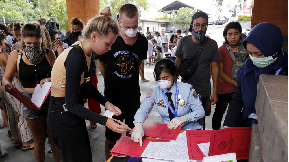 Long queues built up at the immigration office in Bali’s Jimbaran as foreigners tried to get an emergency extension to their visas amid the spread of COVID-19
