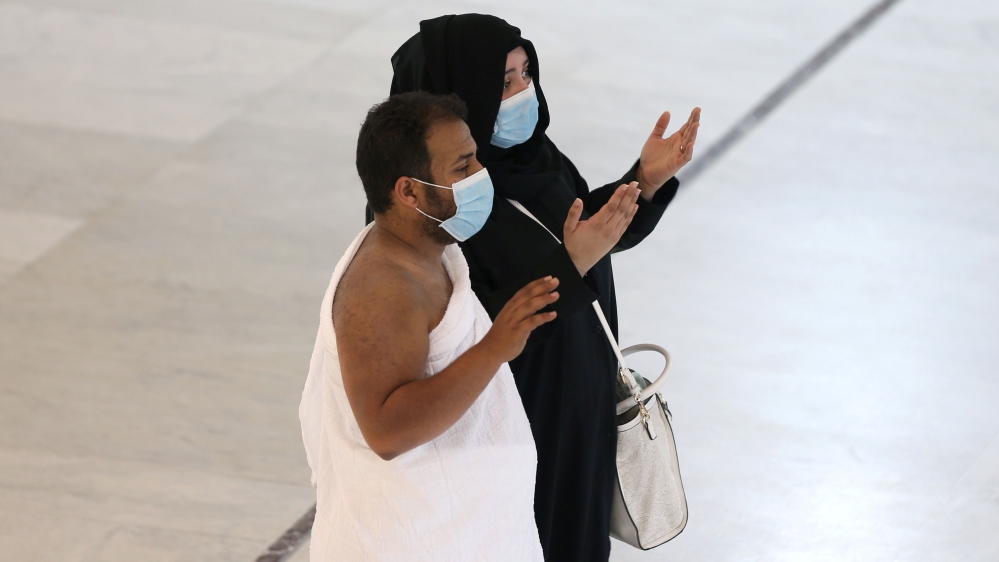 Muslim pilgrims wear protective face masks to prevent contracting coronavirus, as they pray at the Grand Mosque in the holy city of Mecca, Saudi Arabia