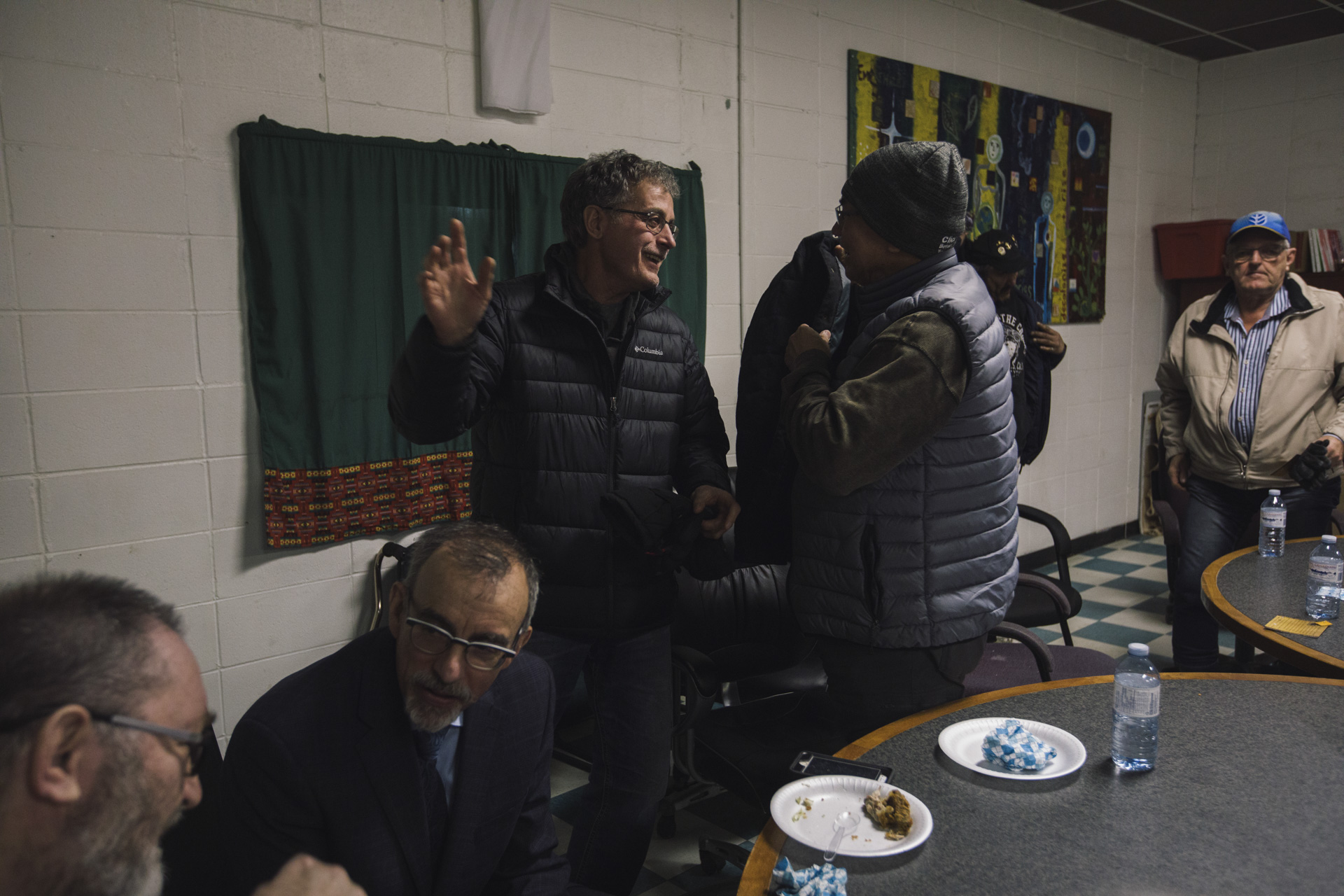 Amil Shapka, standing left, greets a friend during a meeting of the Reconciliation Committee in St Paul, Alberta on Tuesday, January 7, 2020