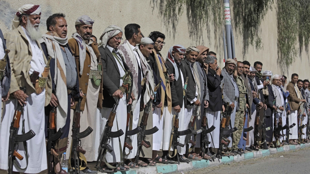 Tribesmen loyal to the Houthis hold their weapons at a gathering in Sanaa aimed at mobilising more fighters
