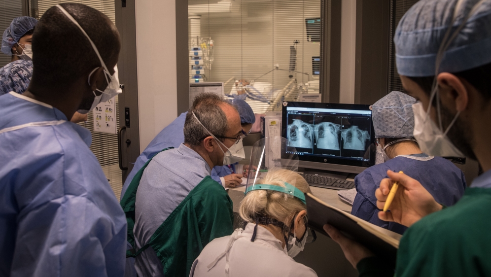 Doctors and nurses look at scans at the Acibadem Altunizade Hospital in Istanbul