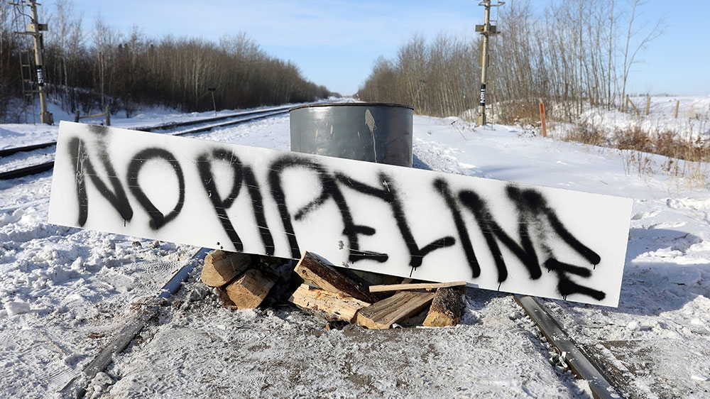 Supporters of the Indigenous Wet’suwet’en Nation’s hereditary chiefs camp at a railway blockade as part of protests against British Columbia’s Coastal GasLink pipeline last year