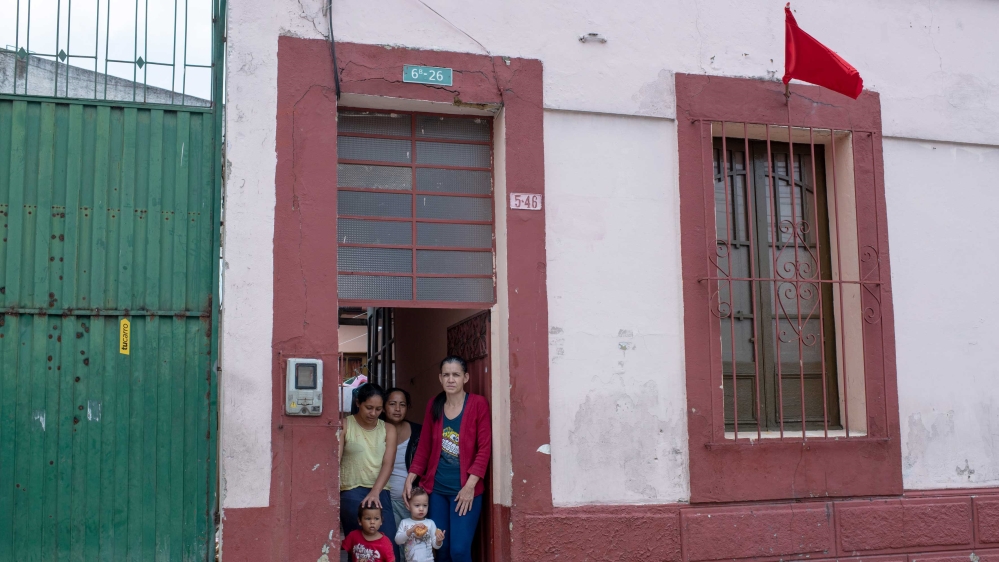 A red flag is displayed on the house of a Venezuelan family living in this house in the Belen district of Bogota with seven other Venezuelan families