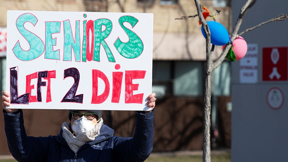 A protester outside a long-term care facility during the coronavirus outbreak in Montreal