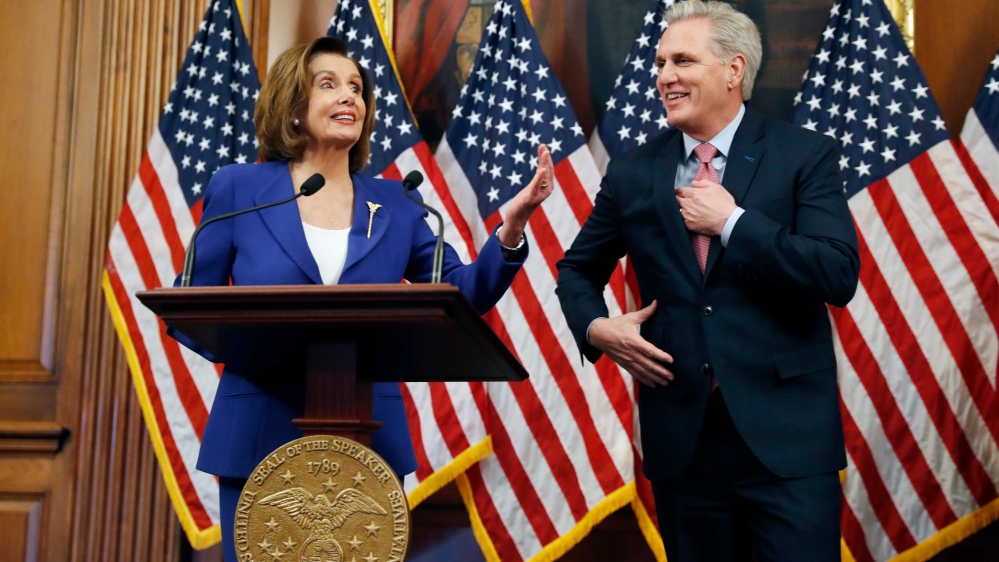 House Speaker Nancy Pelosi and House Minority Leader Kevin McCarthy participating in a bill enrollment ceremony for the Coronavirus Aid, Relief, and Economic Security (CARES) Act, after it passed in the House, in Washington, DC