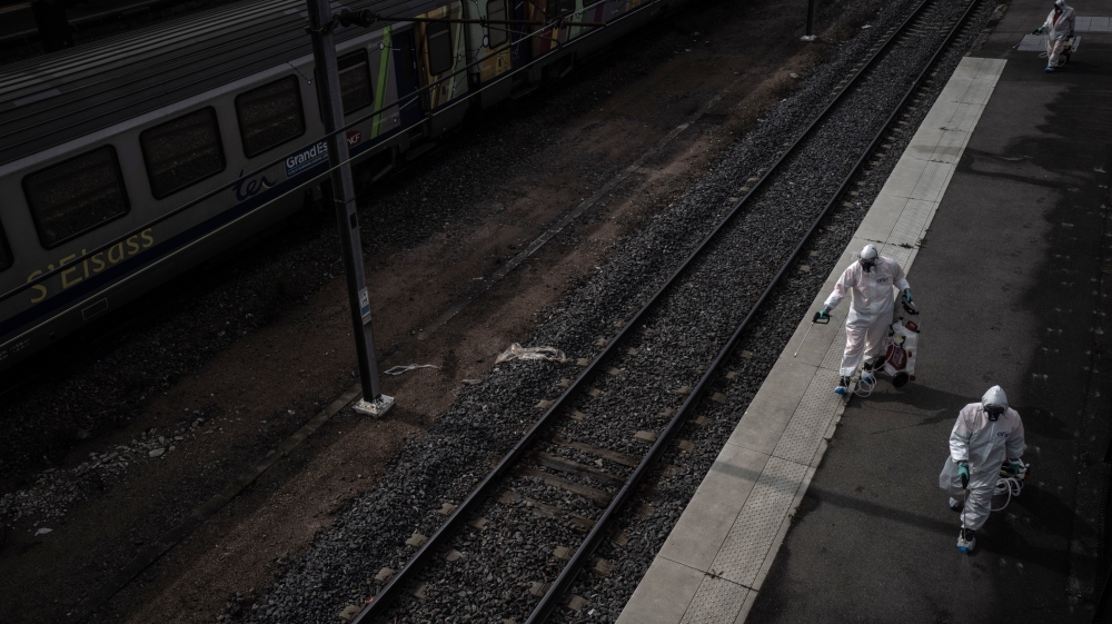 A team decontaminates the Mulhouse train station after a dozen COVID-19 patients were evacuated by train from the area to free some much-needed hospital beds in Mulhouse