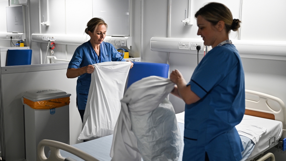 NHS staff are seen inside the new NHS Louisa Jordan hospital which is now ready to take its first coronavirus patients in Glasgow, United Kingdom