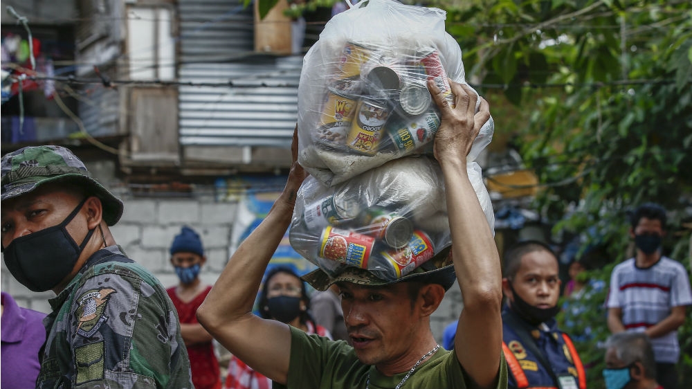 Relief goods arrive at a low-income community in Quezon City for distribution earlier this month