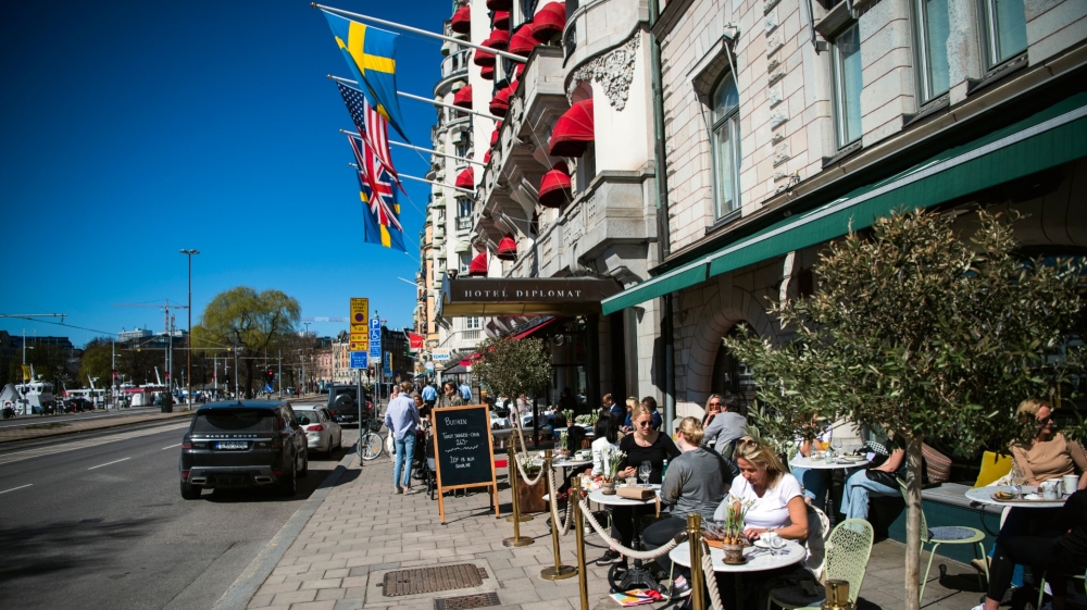 People have lunch at a restaurant in Stockholm amid the coronavirus pandemic