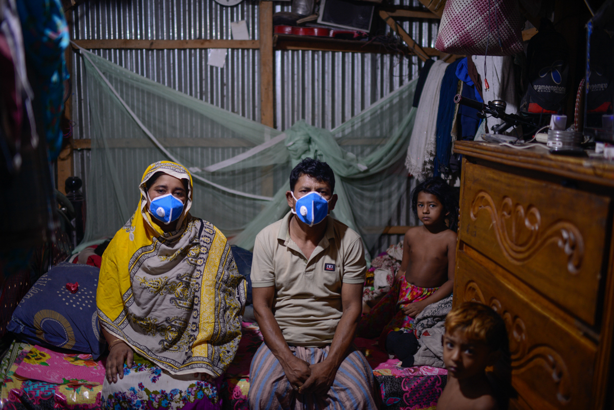 Moina Dewan is a rickshaw puller who lives with his family of six in Korail. On some days, his health prevents him from working, and his son pulls the rickshaw to support the family. Neither father no