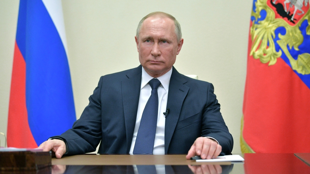 Russian President Putin delivers a televised address to the nation about the coronavirus disease outbreak, outside Moscow