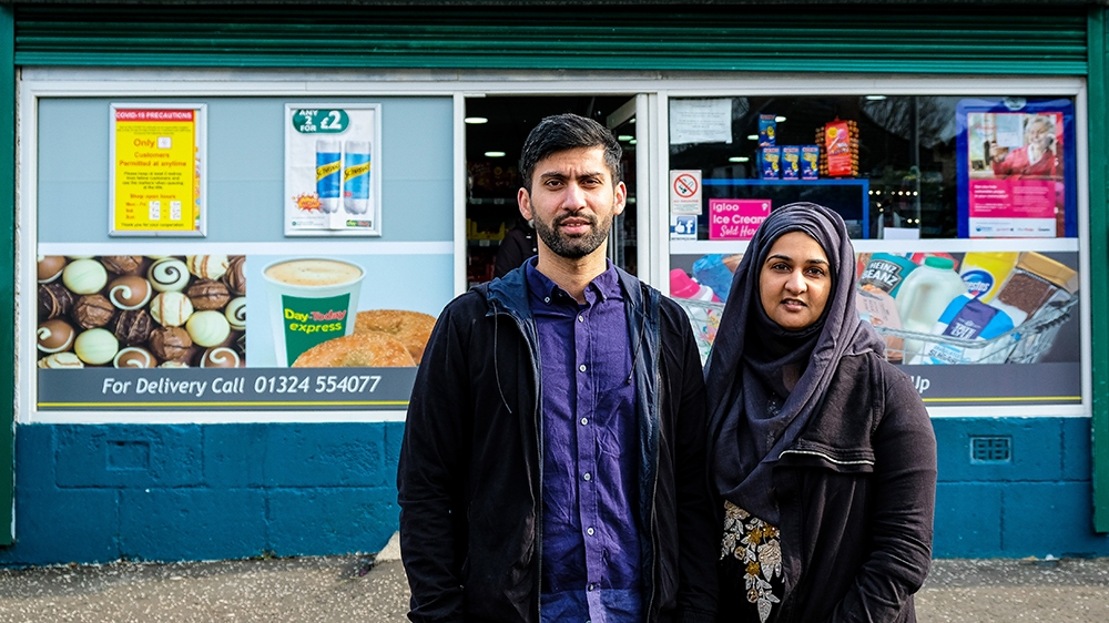 Jawad Javed and his wife Asiyah have been handing out free care packages since the coronavirus crisis escalated in March.. [Sobhan Sheikh/Al Jazeera]