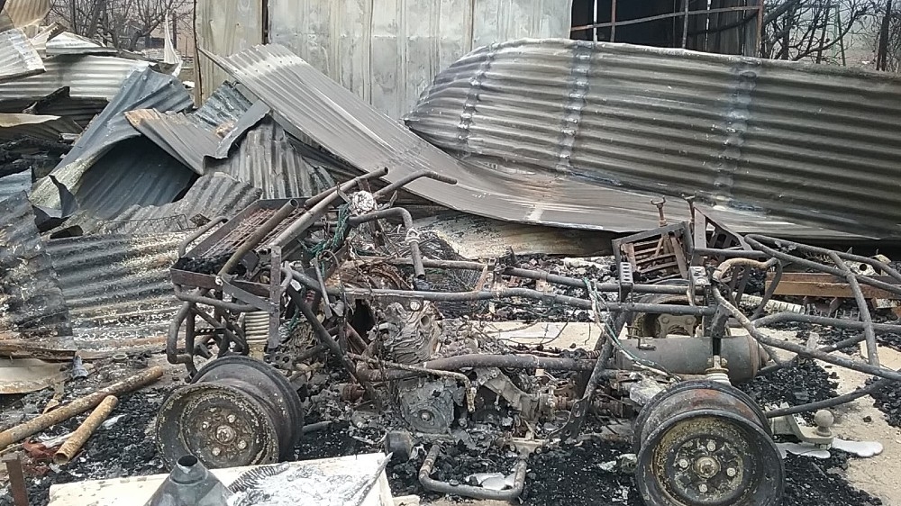 The fire tore through the Sutherland’s property reducing buildings and vehicles to charred wrecks