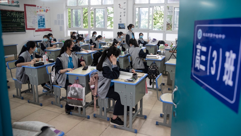 Senior students attend class at a high school in Wuhan in China’s central Hubei province [AFP]