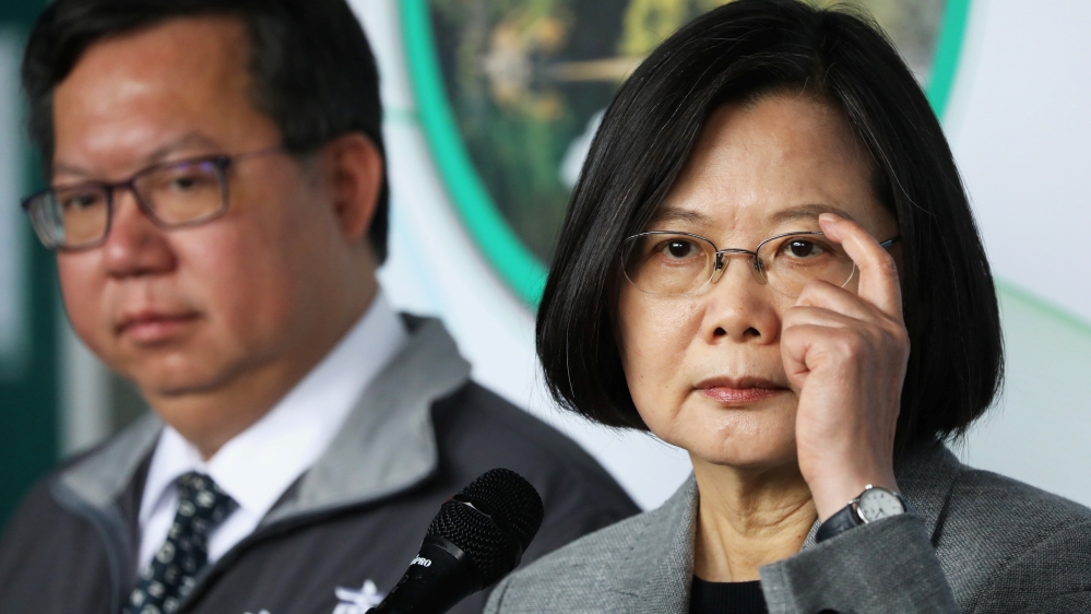 Taiwanese president Tsai Ing-Wen answers the media during a visit to a non woven filter fabric factory, where the fabric is used to make surgical face masks, in Taoyuan