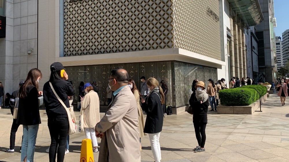 People queued from as early as 5am outside a luxury shopping centre for the Chanel boutique