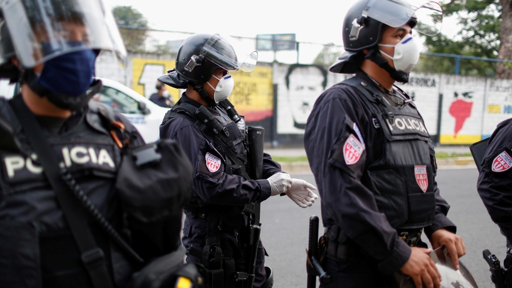 Riot police preparing to contain people who were detained for violating El Salvador’s nationwide lockdown measures in San Salvador, El Salvador