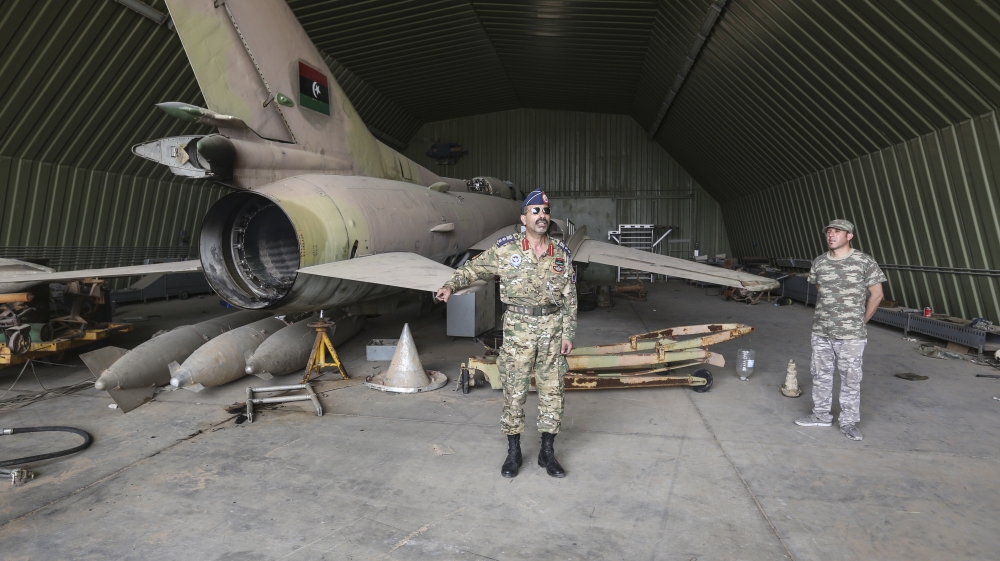 GNA military spokesman Mohammed Kanunu inspects the al-Watiya airbase after its allied forces recaptured it