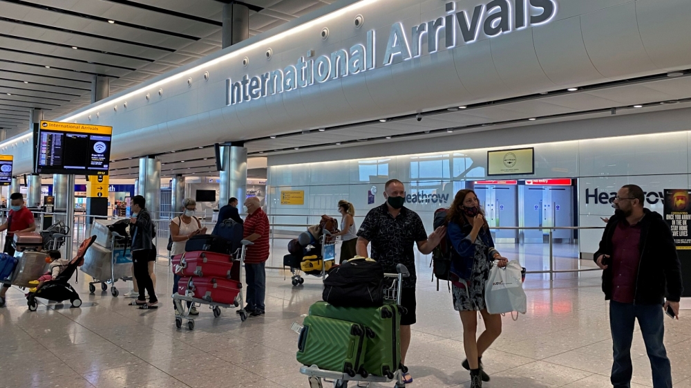 Passengers arrive from international flights at Heathrow Airport in London, the United Kingdom