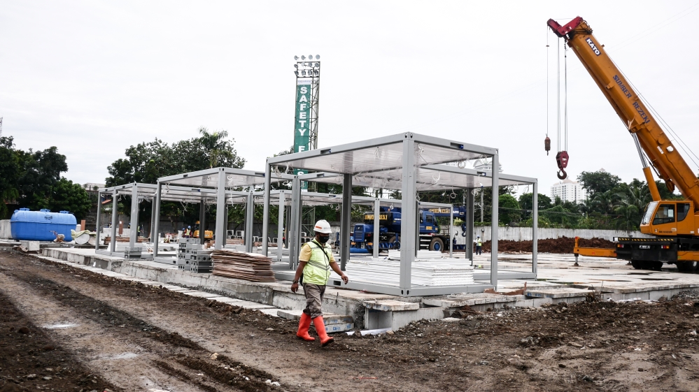 Construction workers are building the makeshift Pertamina hospital for coronavirus in Jakarta