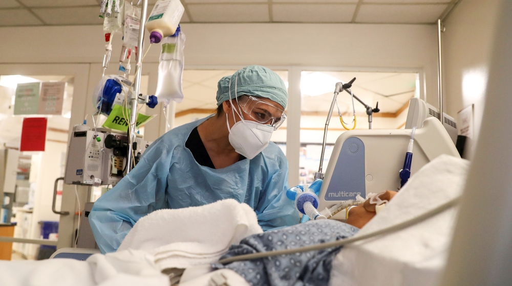 Co-director of the intensive care unit at CommonSpirit''s Dignity Health California Hospital Medical Center, Dr. Zafia Anklesaria, 35, who is seven months pregnant, attends to a COVID-19 patient in the