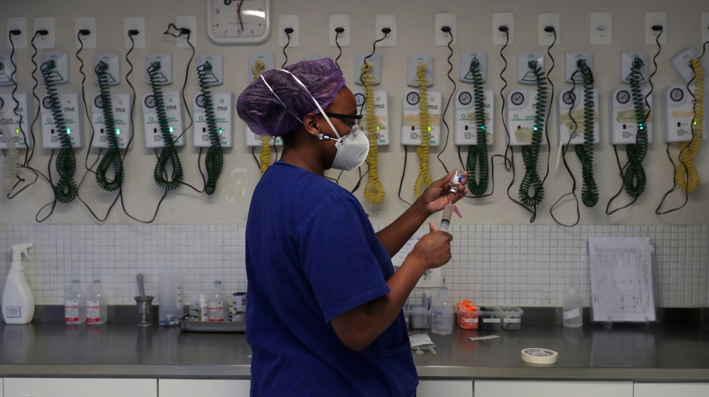 Nurse Jaqueline Borges Dias prepares medications for a patient suffering from the coronavirus disease (COVID-19) at the Intensive Care Unit (ICU) of Emilio Ribas Institute in Sao Paulo, Brazil, June 1