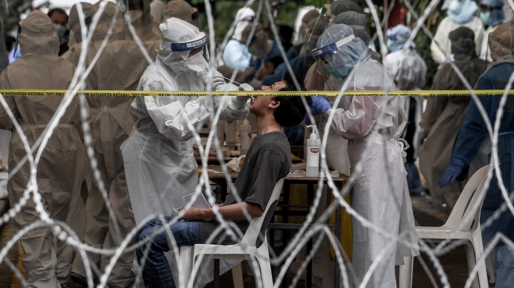 A man is screened for coronavirus on May 26 in Pudu amid concerns about a cluster of coronavirus cases in the area