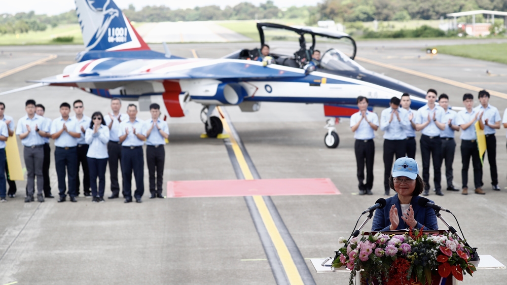 Taiwan President Tsai Ing-wen (right) speaks during the presentation of Taiwan’s newly built Indigenous Advanced Jet Trainer (AJT) named ‘Yung Yin’ or ‘Brave Eagle’ in June