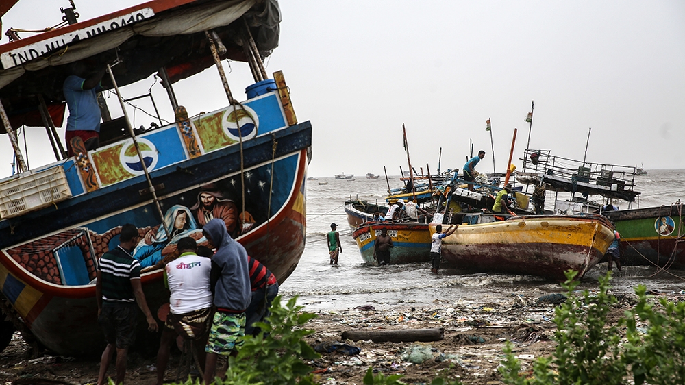 Indian fishermen anchor their boats in Uttan village, near Mumbai, as Cyclone Nisarga makes its landfall