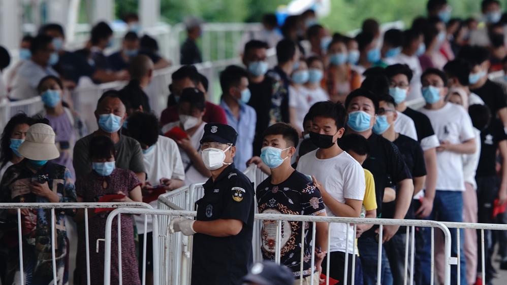 Crowds of masked people waiting for tests have become a common sight in recent days across Beijing, which has tested more than 350,000 people, with many more expected