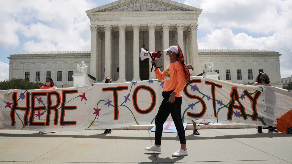 DACA recipients and their supporters celebrate outside the US Supreme Court in Washington, DC
