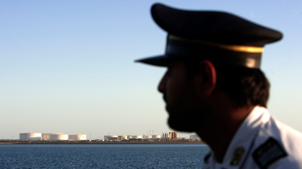 A security person looks on at oil docks at the Chabahar port