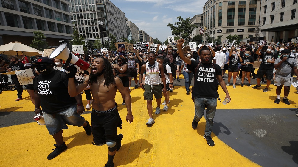 Demonstrators marching near the White House on Juneteenth, marking the day in 1865 when enslaved Black people learned they had been freed from bondage