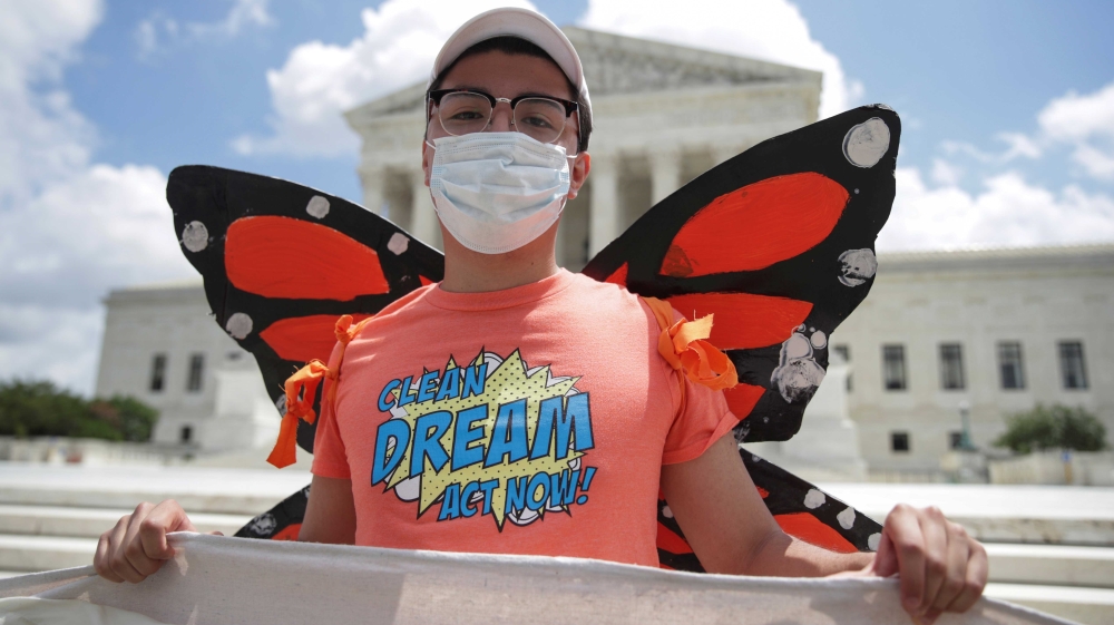 DACA recipient Luis, who immigrated to the US from Colombia when he was three years old, celebrating outside the US Supreme Court