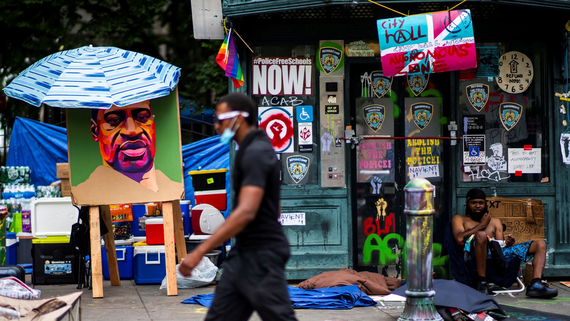A picture of George Floyd hangs in the ‘City Hall Autonomous Zone’ in New York City that has been established to protest the police and in support of Black Lives Matter [Reuters]