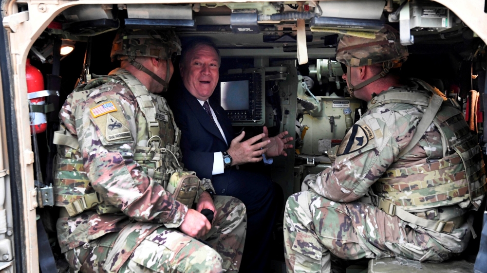 US Secretary of State Mike Pompeo sits in a tank as he talks to US soldiers based in Grafenwoehr, Germany, in November 2019.