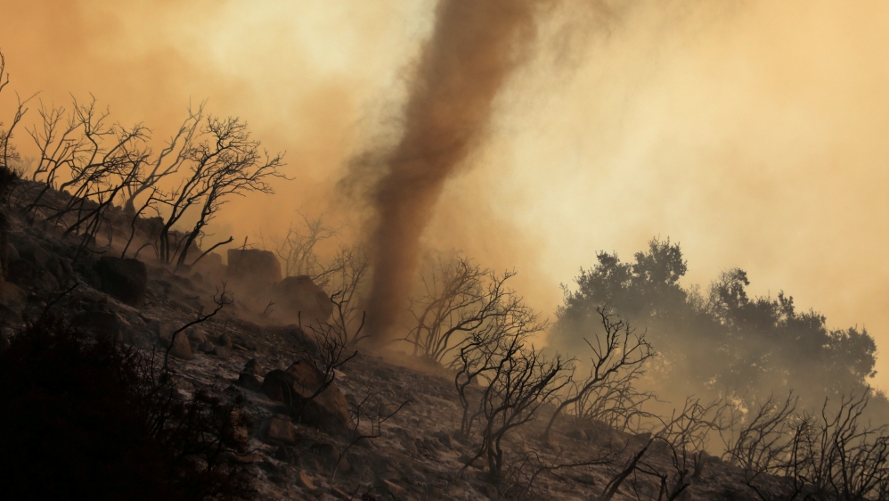 A whirlwind of hot ash and embers moves through a wildfire, dubbed the Cave Fire, burning in the hills of Santa Barbara, California in 2019 [Reuters]