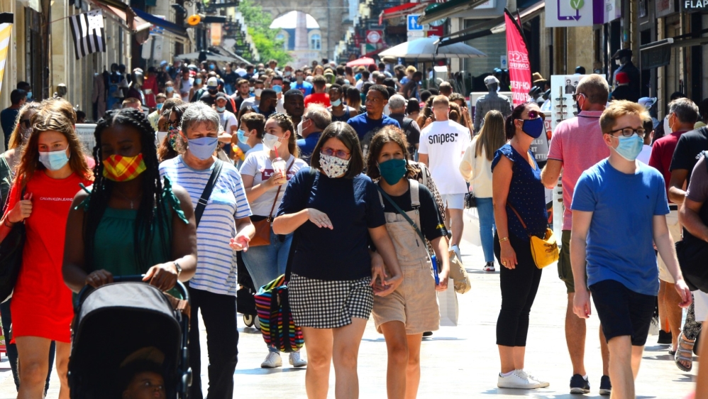 People stroll down Bordeaux’s main shopping street Sainte-Catherine, where wearing a mask is compulsory as of August 15, 2020, to prevent the spread of the novel coronavirus COVID-19