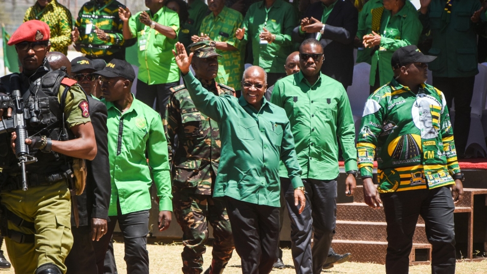 Tanzania”s incumbent president John Magufuli waves as he arrives to give an election speech