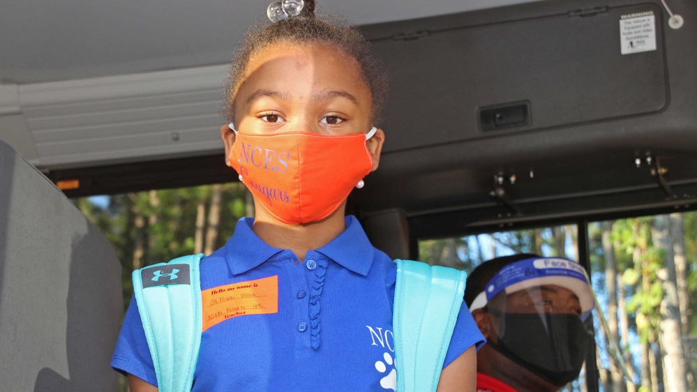Ja Nayah Wash,10, a fourth-grader, pausing before getting on the school bus in Decatur, Mississippi