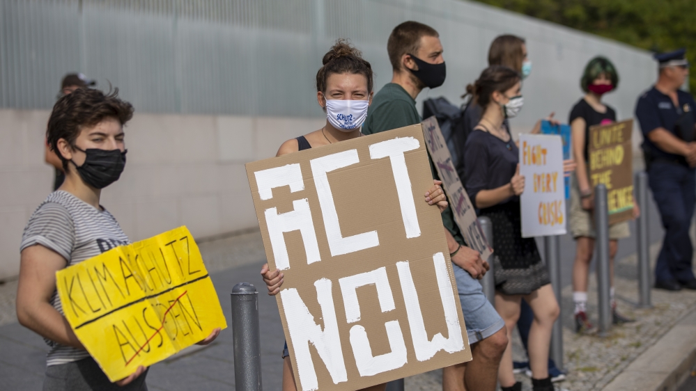 Climate activists demonstrate in front of the German Chancellery