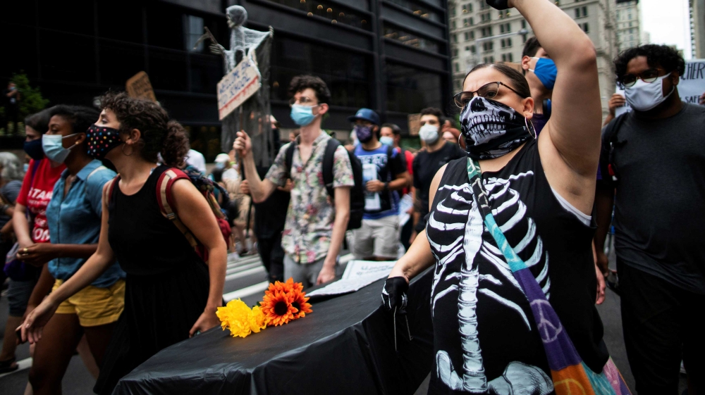 Protesters carrying a symbolic coffin during the National Day of Resistance against schools’ reopening in New York City, US