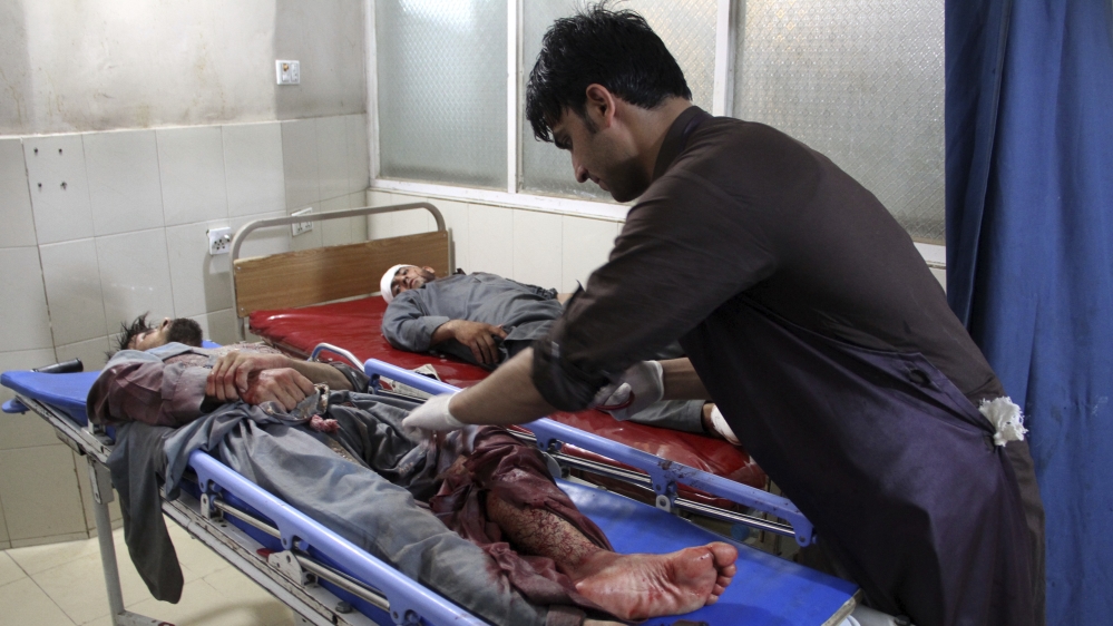 A wounded man receives treatment at a hospital after a suicide car bomb and multiple gunmen attack in the city of Jalalabad [AP Photo]