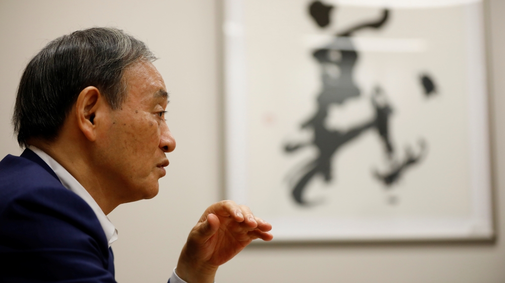 Japan’s top government spokesman Chief Cabinet Secretary Yoshihide Suga speaks during an interview with Reuters in Tokyo, Japan