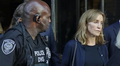 Felicity Huffman leaves federal court after her September 2019 sentencing in the nationwide college admissions bribery scandal
