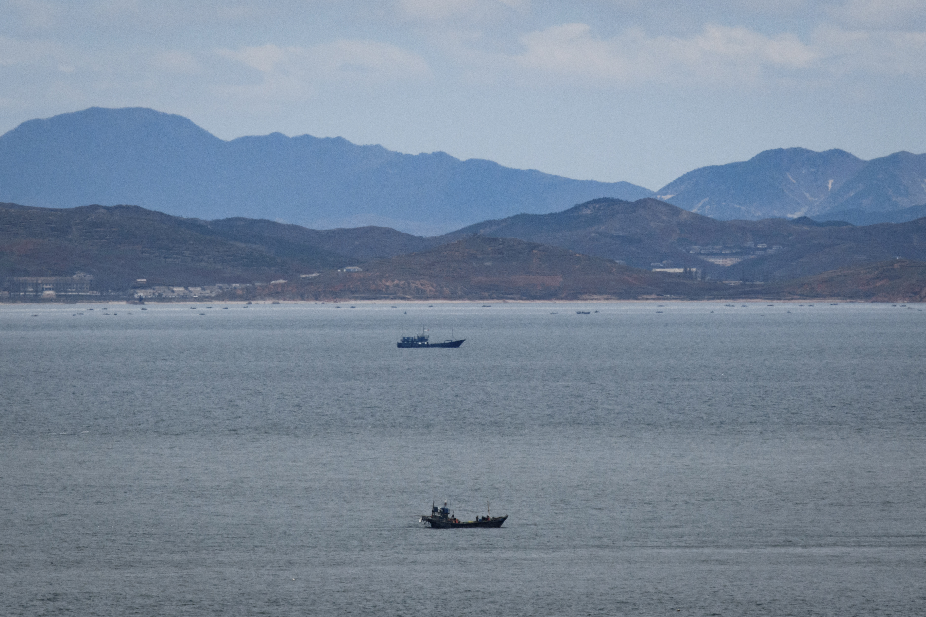 The North Korean coastline from a viewpoint on the South Korea-controlled island of Yeonpyeong near the disputed waters of the Yellow Sea at dawn. North Korea has apologised after its forces shot dead a Southern fisheries official who disappeared off a patrol vessel on Monday and ended up in in its waters