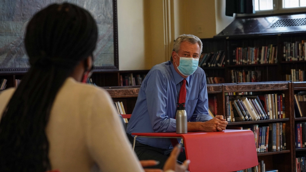 Mayor Bill de Blasio listening as he meets with parents at Bronx Collaborative High School, following their visit to review health safeguards in advance of the reopening of schools in New York