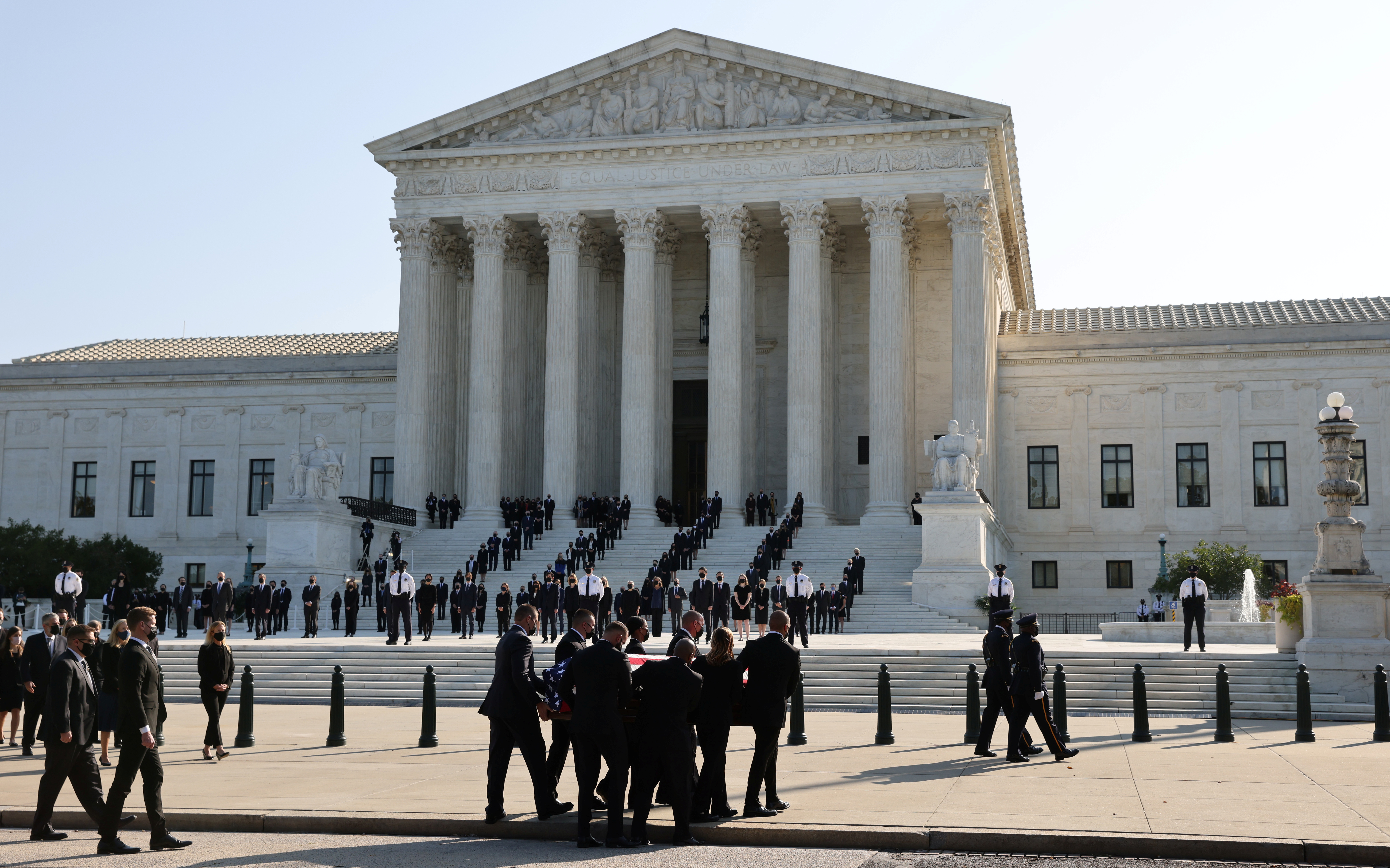 The coffin of the late Supreme Court Associate Justice Ruth Bader Ginsburg is carried into the US Supreme Court, where it will lie in repose through Thursday