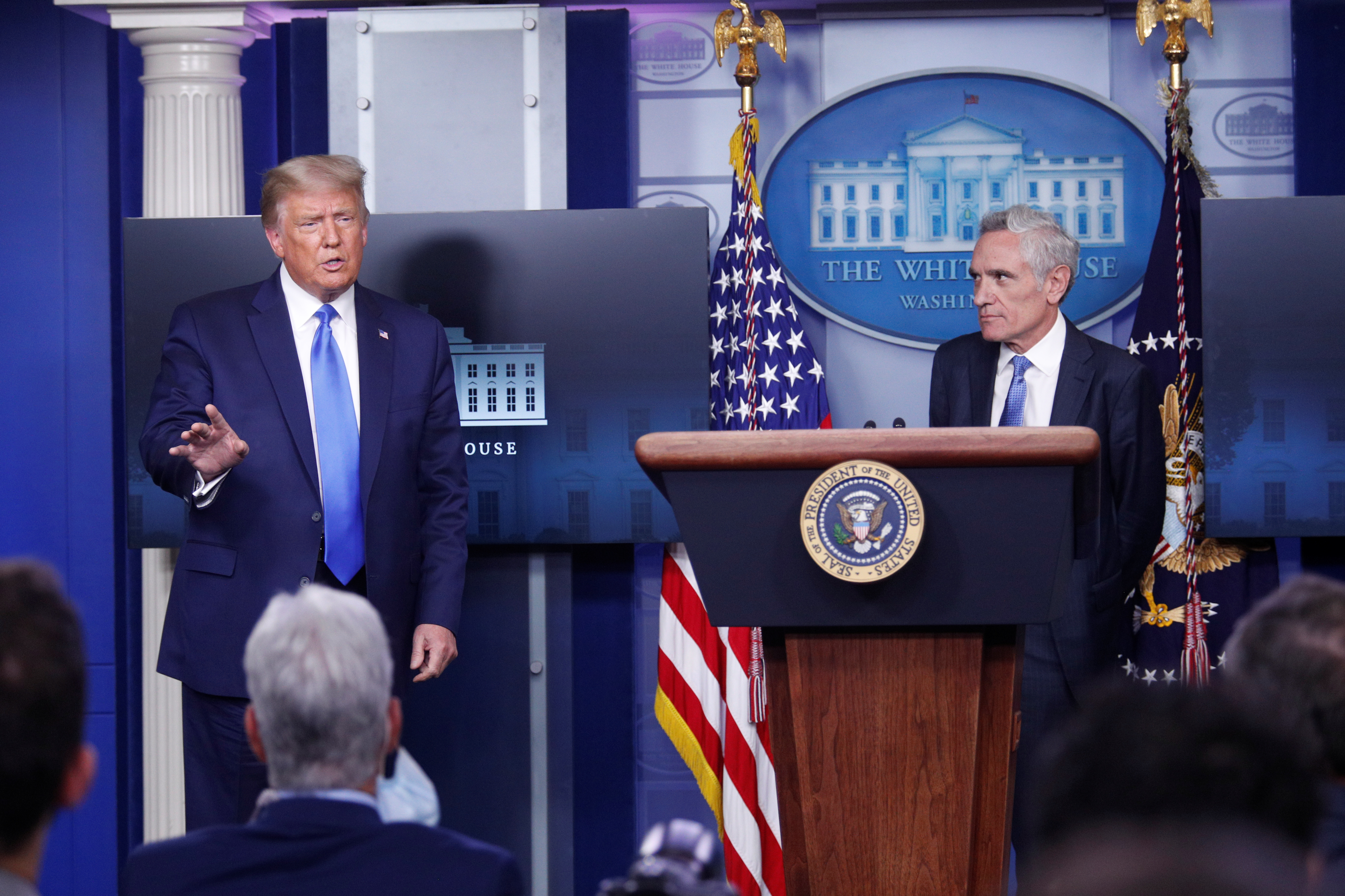 President Donald Trump and White House pandemic adviser Scott Atlas speak to reporters during a news conference at the White House on September 23, 2020.