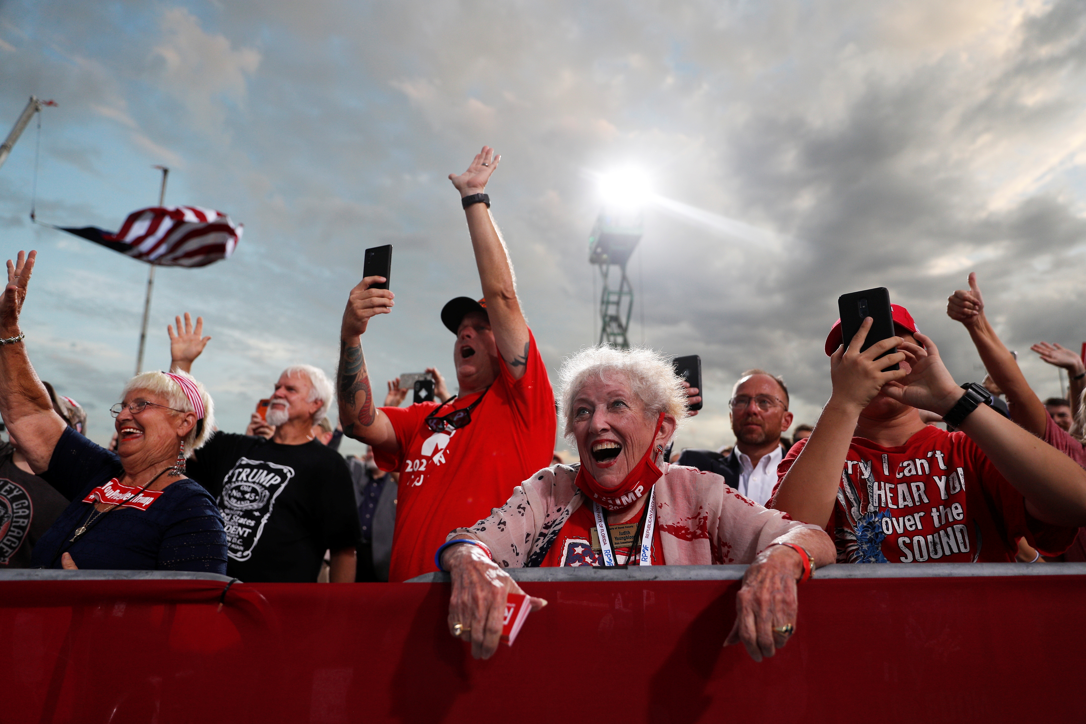People cheer for President Donald Trump at a campaign rally at Cecil Airport in Jacksonville, Florida on September 24, 2020.
